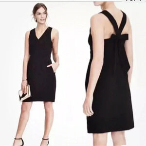 Black knee-length sheath dress with v-neck sleeveless design for cocktail